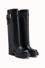 Bottes hautes à plateformes et boucles